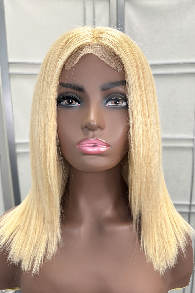 Blonde Cap Wig made from 100% Remy hair, featuring a glueless design and adjustable straps - Front View