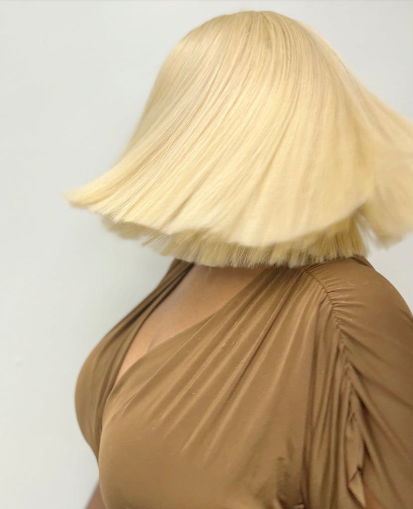 Blonde Cap Wig made from 100% Remy hair, featuring a glueless design and adjustable straps - Back View